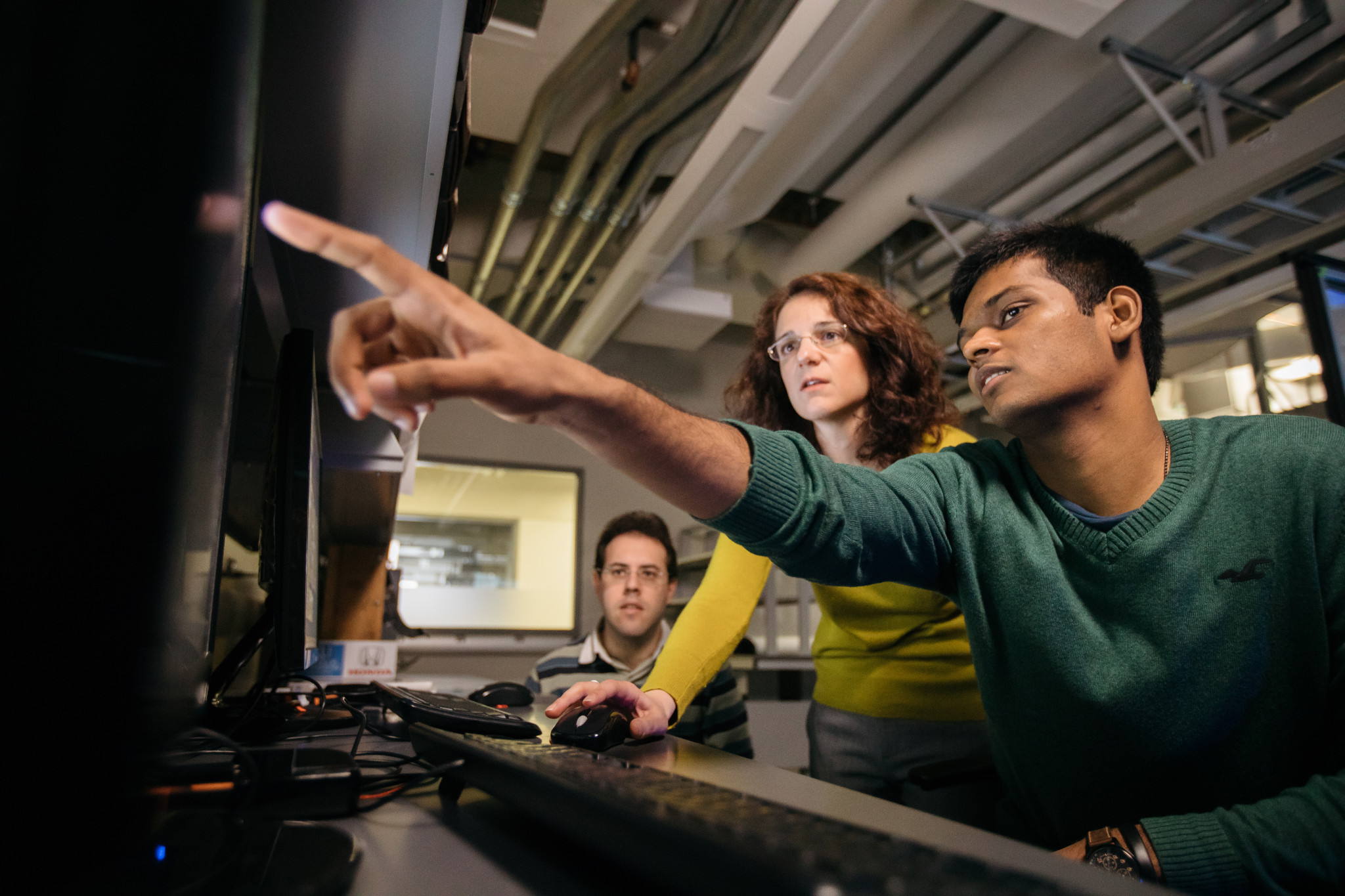 two students look at a computer